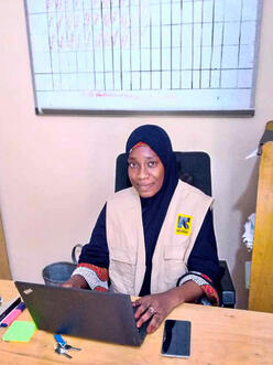Hadiza sitting at her desk