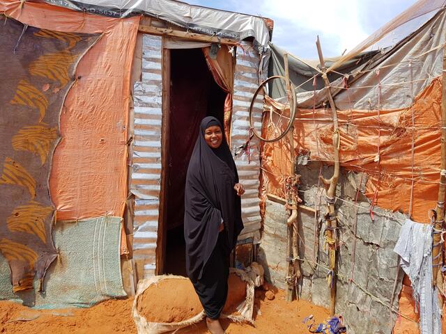 Beeso stands outside her home in Harhaar camp