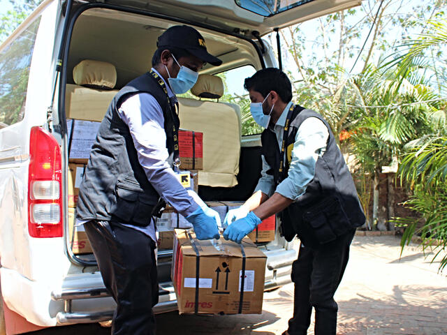 IRC staff unloads equipment as the IRC primary health care center in Cox's Bazar ramped up preparations for confronting the coronavirus pandemic.