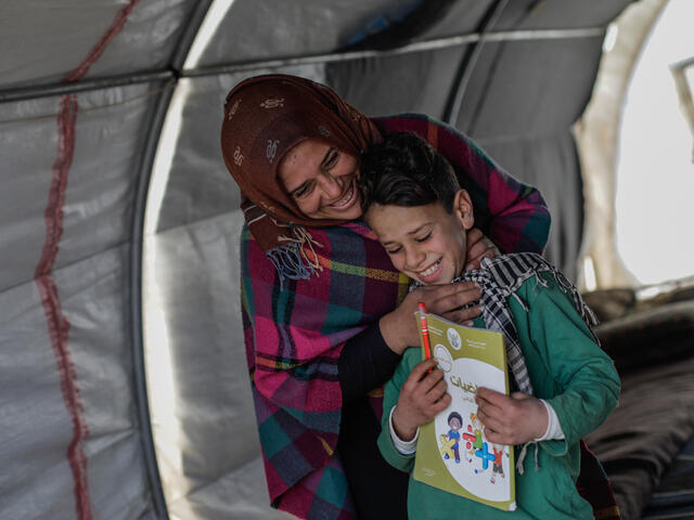 Omar, 10-year-old Syrian with his mother