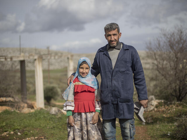 Sara, 10-year-old Syrian with her father