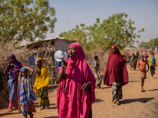 Zainab - A Somali activist speaking through a bullhorn