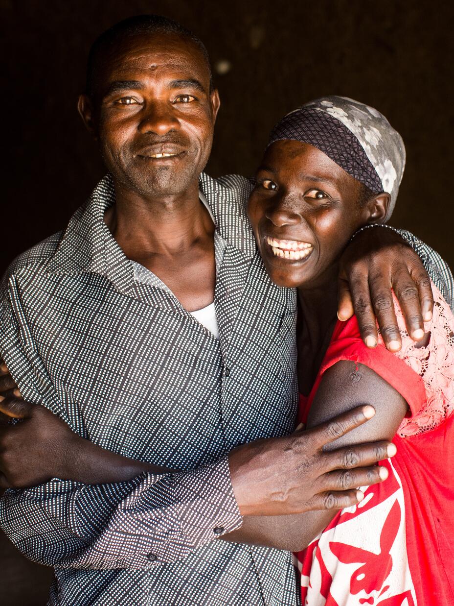 A man and a woman hugging and smiling