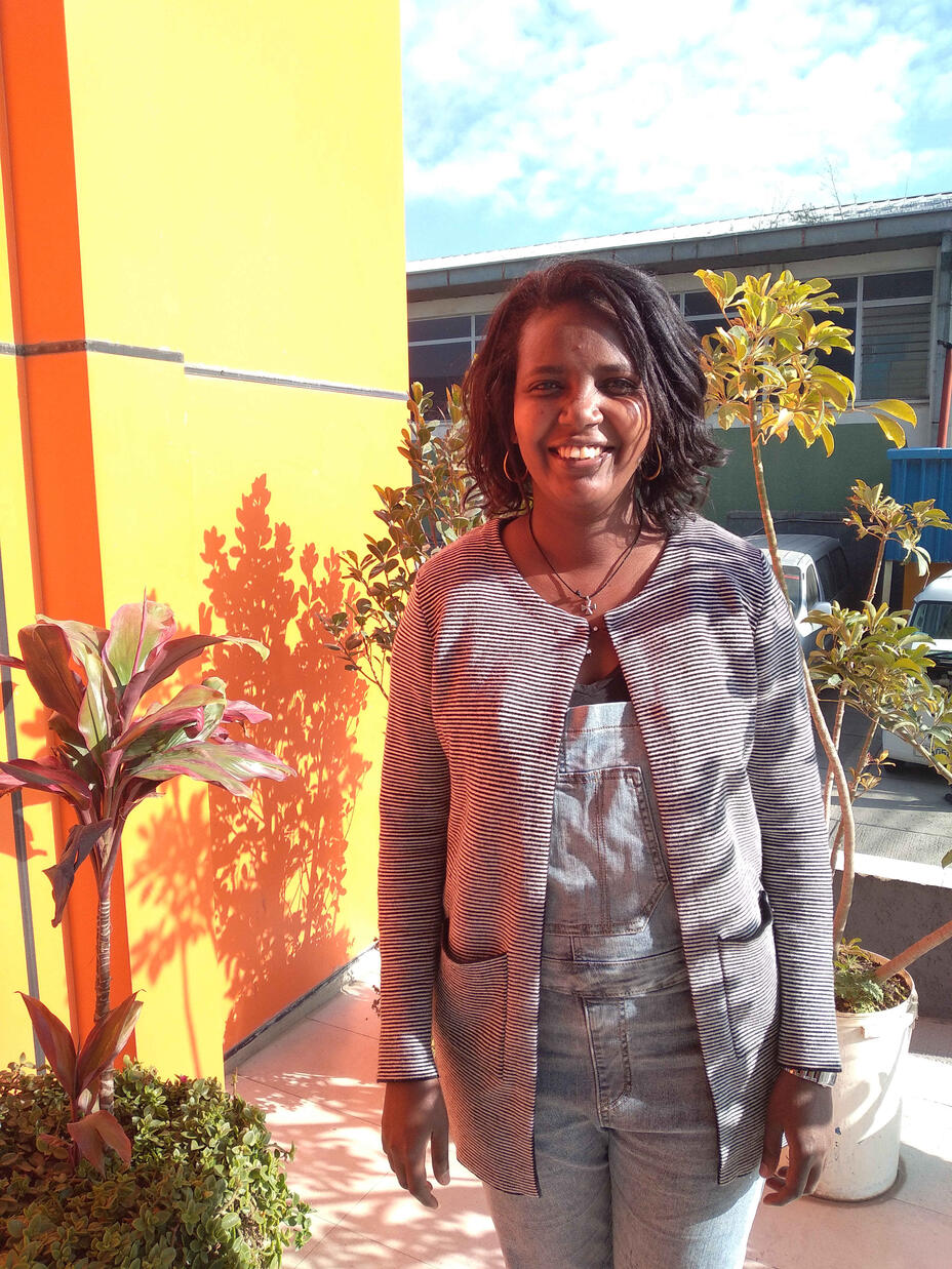 Masresha Mitiku standing in front of the IRC office in Addis Ababa