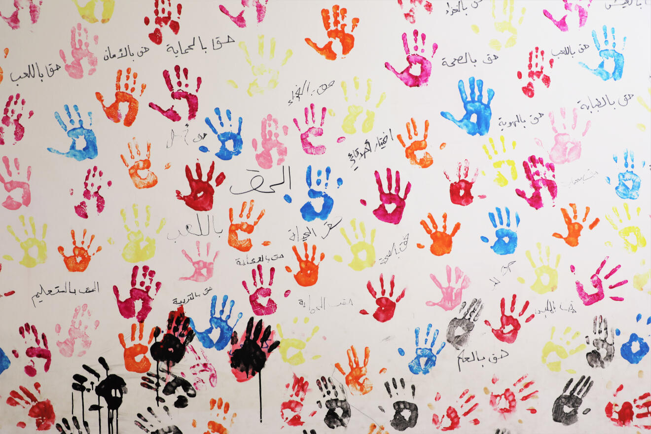 Children's handprints on the walls of the IRC centre in North Lebanon