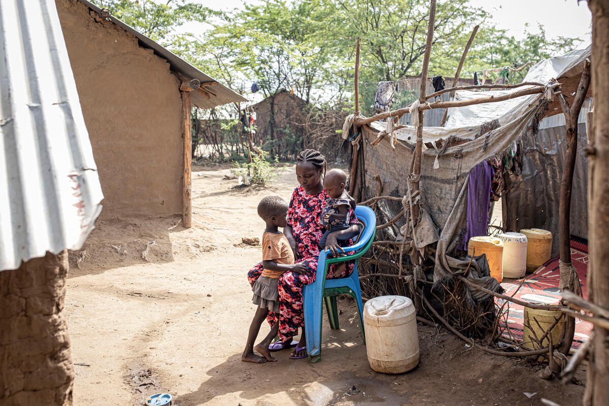 Judith Idiengol, 27, with her daughter Vanessa, 1, and Jennevive Tasha, 5, at their home in Kakuma Refugee Camp, Turkana, Kenya