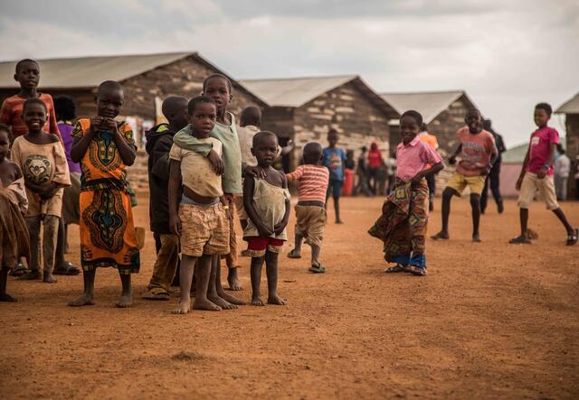 Children in front of some Huts in Uganda
