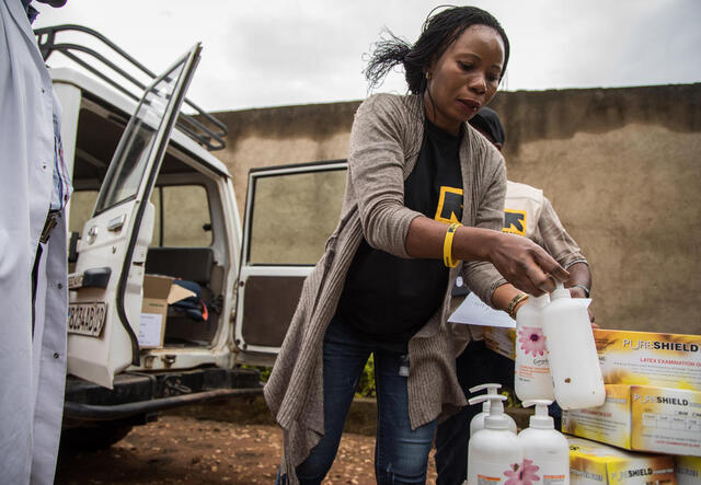 Dr. Sylvie Musema Ngimba of the IRC delivers personal protective equipment, sanitizer and other supplies to a local health facility in Beni to protect its staff and patients from Ebola.