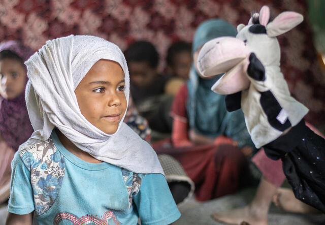 6-year old Ashwaq interacting with a cow puppet
