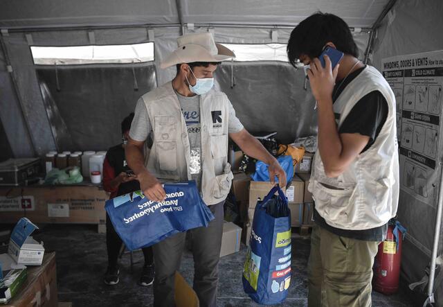 Two IRC staff prepare hygiene promotion activities in Lesvos.