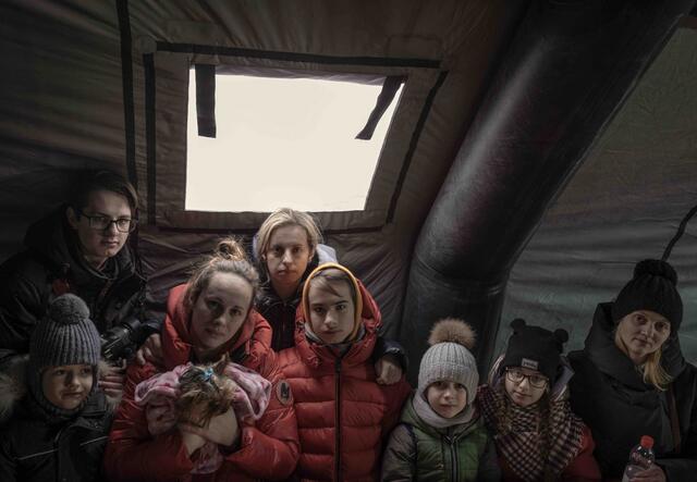 Ukrainian refugees gather at Medyka border crossing point, Poland