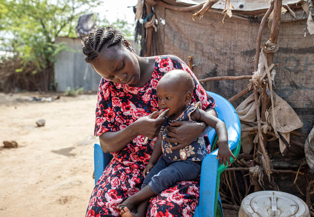 Judith Idiengol, 27, feeds her daughter Vanessa, 1, at Locher Angamor Health Dispensary in Kakuma Refugee Camp, Turkana, Kenya