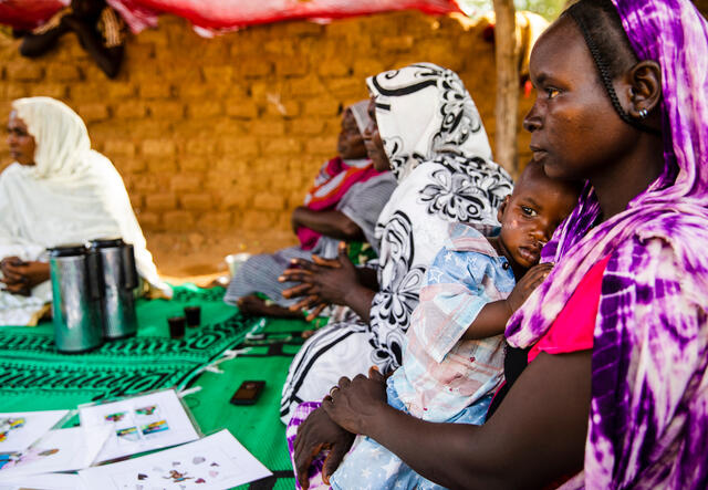 A mother holds her child during a counseling session with clients in Mangalme, Guera region, Chad. In Chad, over 1 million children suffer from acute malnutrition. IRC is piloting a new malnutrition solution here designed to increase access to treatment.