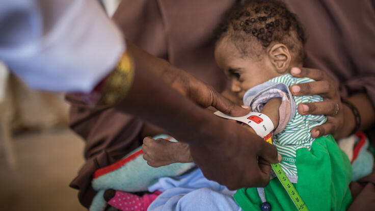 A young Somalian child is examined for nutrition